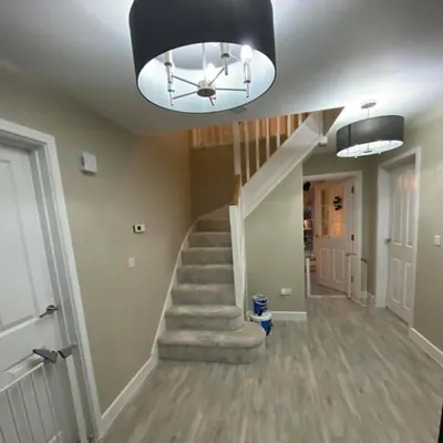 Freshly painted hallway and staircase with grey walls