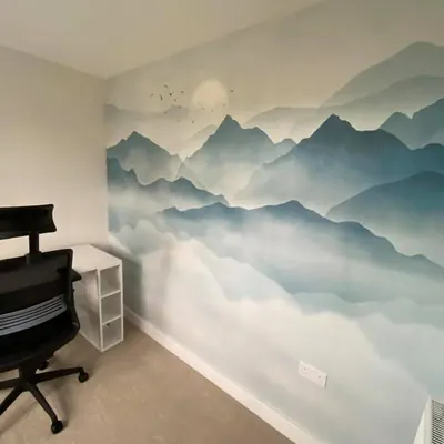 Misty blue mountain mural on a home office wall